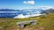 Millstaettersee - A wooden bench with a panoramic view on the Alpine valley from the top of Granattor in Austrian Alps