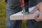 Milwaukee power tools Man using cuts wood electric jigsaws close up