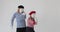 Mime artist couple dancing over white background