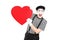 Mime artist holding a big red heart