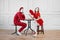 Mime artists in red costumes, scene at the table