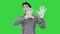 Mime holding touching imaginary wall and making imaginary bird on a Green Screen, Chroma Key.