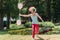 Mime performs in the park with balloons. Clown shows pantomime on the street