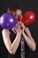 Mime with red nose and baloons
