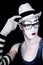 Mime in white hat glasses and gloves