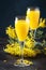 Mimosa alcohol cocktail with orange juice and dry champagne or sparkling wine in glasses, blue background, copy space