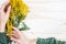 Mimosa Bouquet on White Wood Table