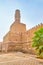 The minaret of Al-Hakim Mosque over the city walls, Cairo, Egypt