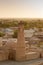 The minaret and the ancient city of Khiva at sunset