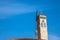 Minaret of the Gazi Husrev begova Mosque next to the clocktower of Sarajevo bazaar, in Bosnia and Herzegovina