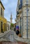 Minaret of the Grand Mosque Cami Kebir seen at the end of a narrow street in the Old Town of Limassol.