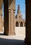 Minaret of Ibn Tulun public historical mosque framed decorated arch, Cairo, Egypt