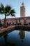 Minaret of Koutoubia-Mosque with mirror image in a water basin