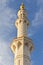 Minaret of the mosque against blue skies