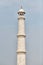 Minaret of Taj Mahal white marble mausoleum landmark in Agra, Uttar Pradesh, India, white tower