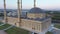 Minarets and dome of Mosque. Panoramic aerial view from drone.