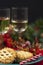 Mince pies a wine glasses on a table decorated for christmas