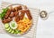 minced beef skewers with potato fries on plate