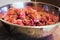 Minced meat for meatballs in a stainless steel bowl.