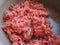 Minced meat in a metal saucepan. Delicious fresh ground meat for making cutlets, steaks, hamburgers, meatballs