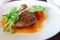 Minced steak and vegetables on a white plate