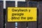 Mind the gap warning sign on railway platform