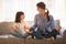 Mindful mom teaching yoga happy child daughter sitting on couch