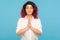 Mindfulness practice. Portrait of peaceful hipster woman with fancy red hair keeping hands in namaste