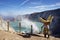 Miner carrying baskets of sulphur out of Ijen crater, Kawah Ijen