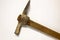 Miner hammer like pickaxe or mattock on white isolated background with shadow. Closeup view of rustic old hand tool for hard