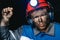 Miner man hands protest fist up revolution coal mine. Concept workers strike