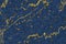 mineral gold in dark blue marble surface of cave for interior wallpaper