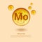 Mineral Mo. Molybdenum. Mineral Vitamin complex. Golden balls. Health concept. Mo Molybdenum