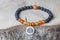 mineral stone beads bracelet on wooden background
