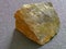 the mineral is a stone chip with yellow inclusions