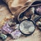 Mineral stones set and magnifying glass, backpack of geologist.