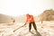 Miners working in dusty and baking hot