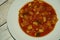 Minestrone soup in a white plate, italian cuisine