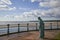 The Minesweeper Sculpture by William Lamb looks across Montrose bay and Scurdie Ness Lighthouse at Montrose in Angus, Scotland.