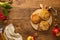 Mini Apple pie tartlets with walnut on wooden table. Delicious dessert for autumn winter dinner.Top view