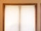 Mini blinds on wood window frame