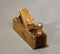 Mini brass hand plane for violin makers, isolated closeup