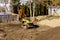 Mini bulldozer with earth doing landscaping works