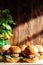 Mini burger on a stand close-up. Children fast food in a restaurant or cafe. Macro photo of burger ingredients with meat and