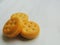 Mini cheese sandwich crackers on white background.