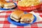 Mini cheeseburgers on a picnic table