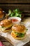 Mini cheeseburgers sliders with ground beef, cheddar, lettuce an