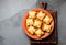 Mini chilean empanadas on clay plate with typical chilean drink vino con harina - red wine with toasted flour