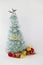 Mini christmast tree with glittering white background. Christmas theme