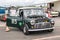 Mini classic car in the paddock area of a race track waiting to be raced